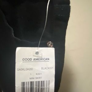 Good American black Skirt with metal holes around